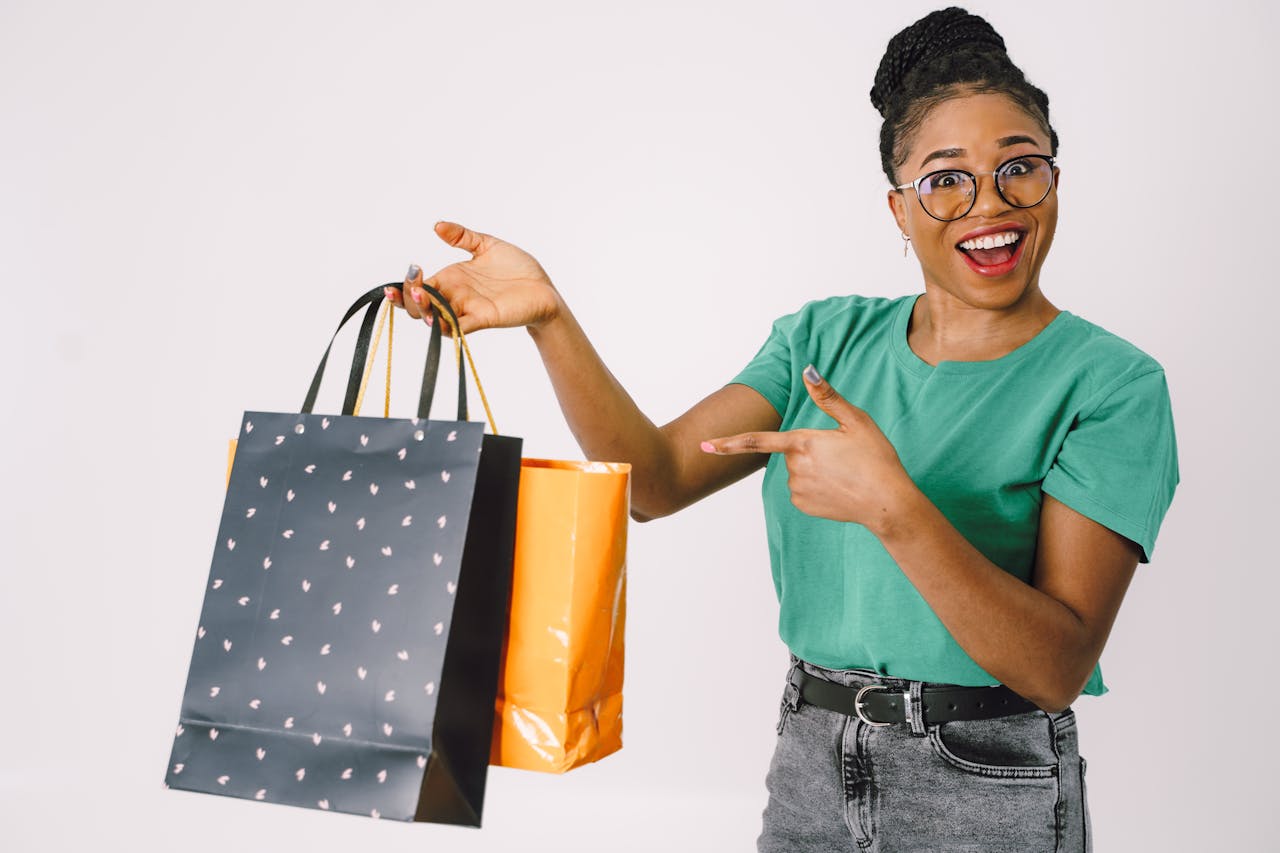 excited woman holding shopping bags
